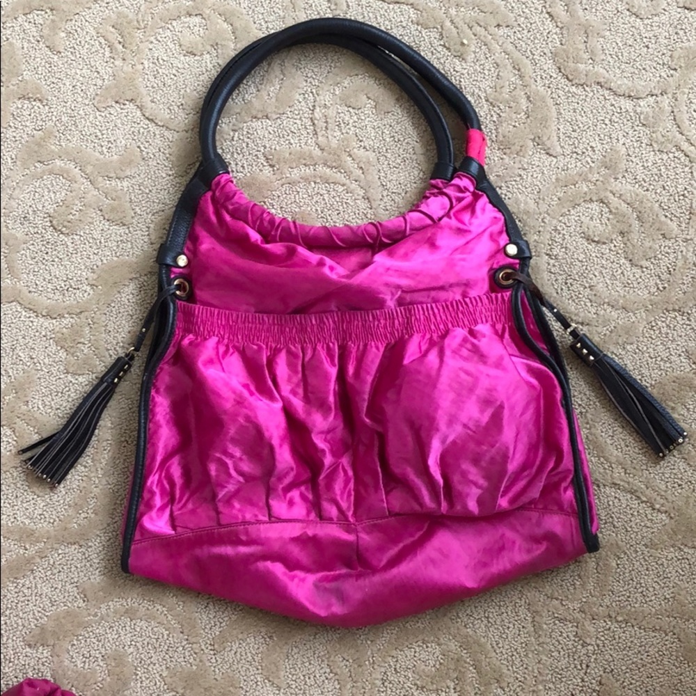 Pink JPK Paris 75 baby bag.
